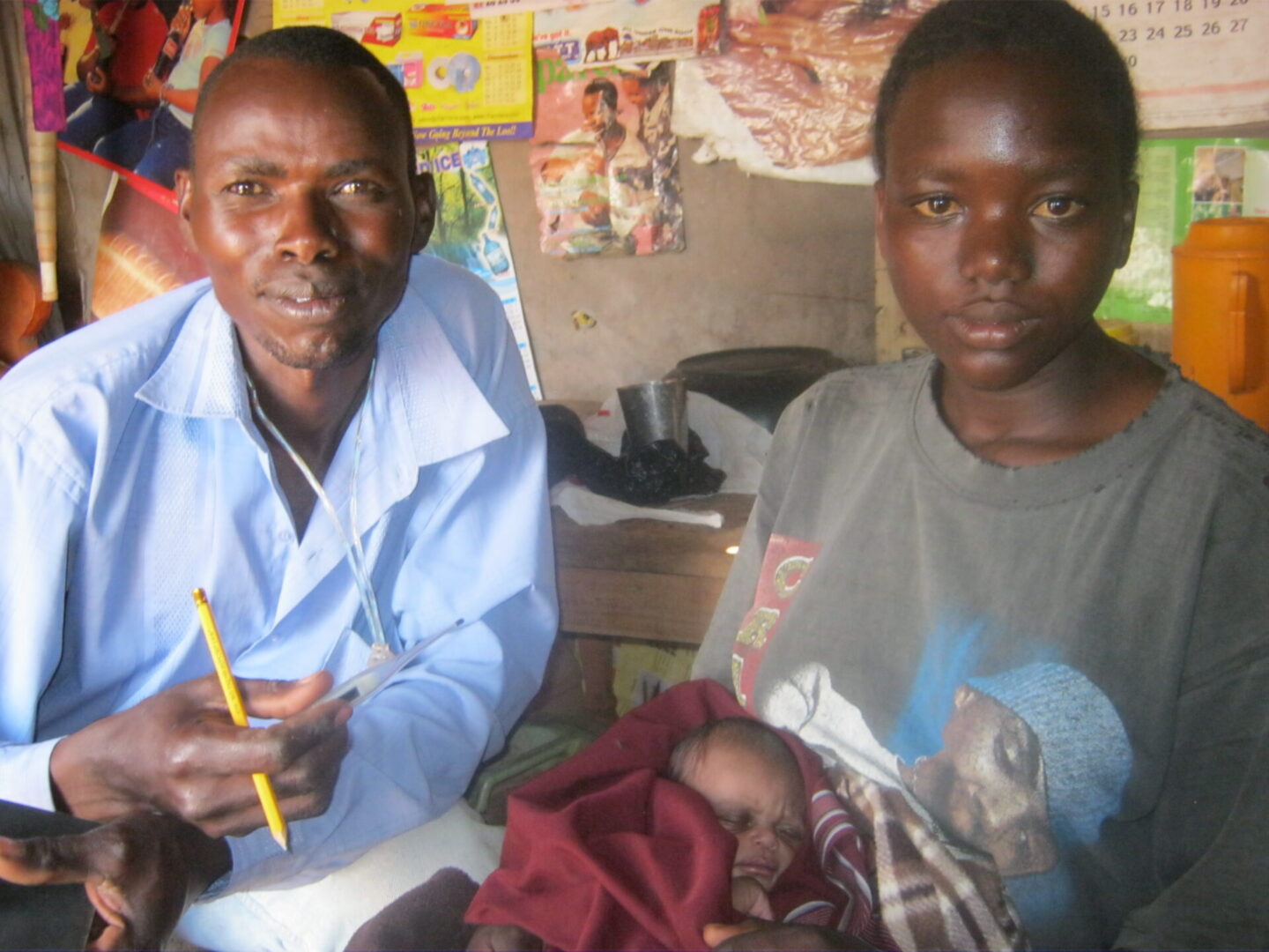 Couple holding sleeping infant