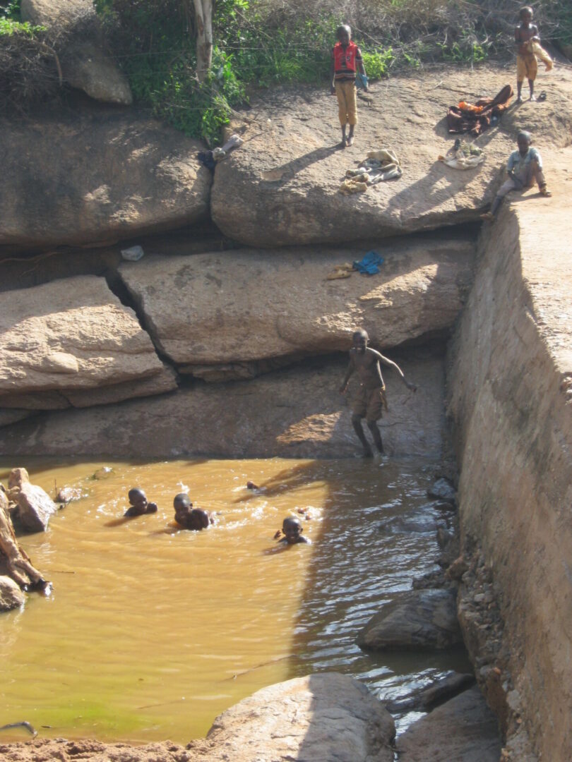Kids playing in muddy water