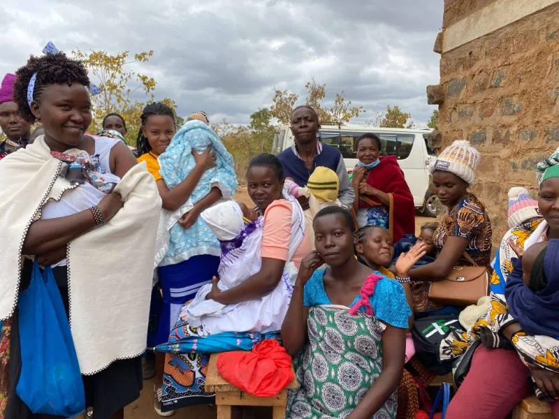 Community gathering near a building
