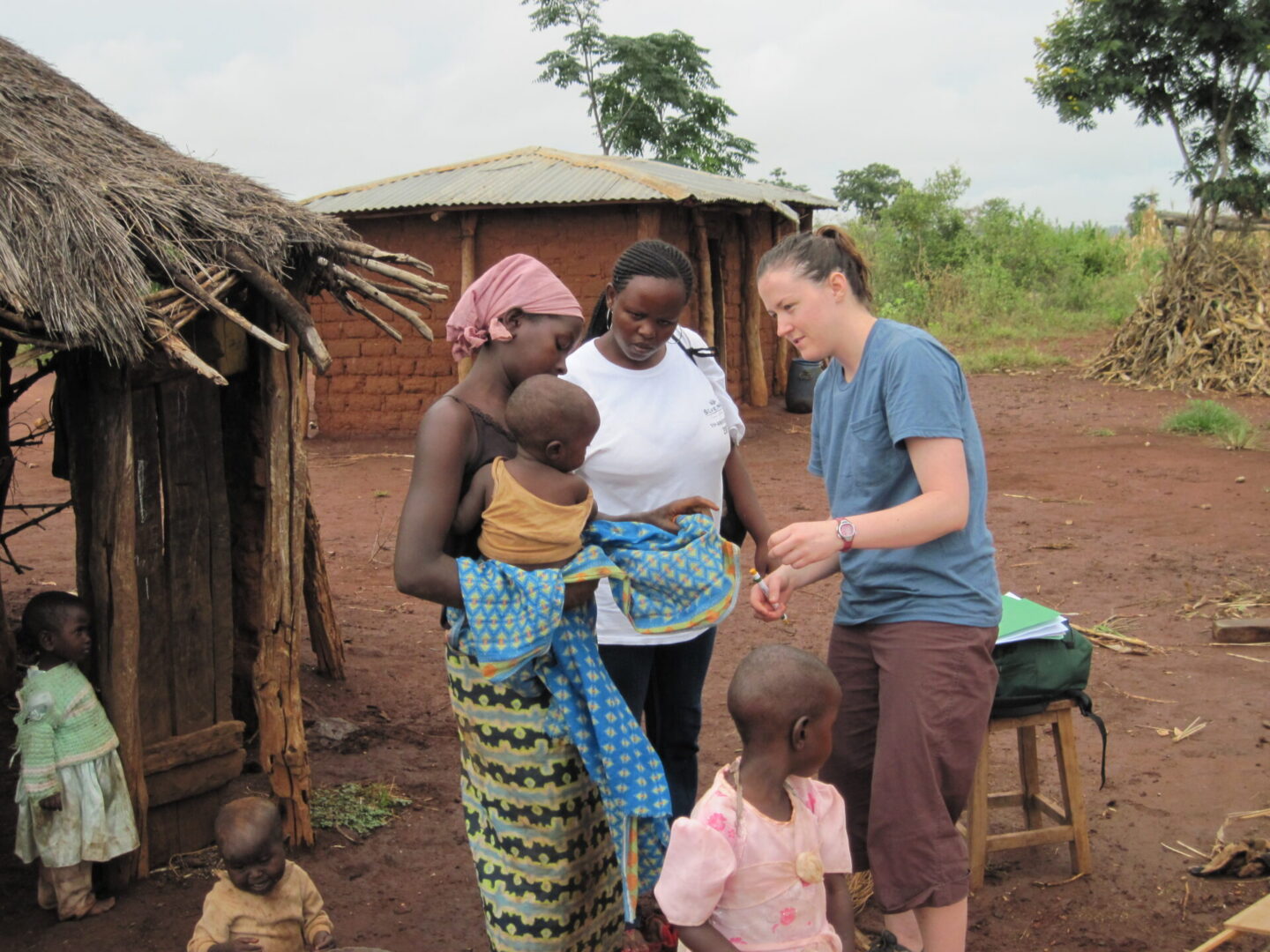 Women and children in village setting